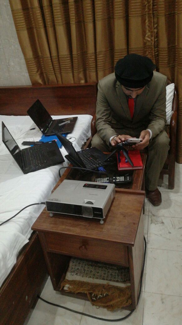 Tech setup with laptops and projector